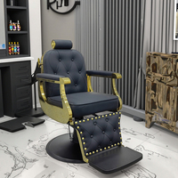 Chaise de salon de coiffure de luxe classique de style antique en cuir noir avec cadre doré et base ronde de haute qualité