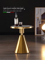 Table basse d'appoint ronde en marbre de luxe pour hôtel, avec tube doré