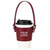Manchon de tasse en cuir de qualité supérieure pour le marché européen avec sangle et logo personnalisé pour la promotion de chaînes de cafés de prestige, faible MOQ