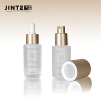 Flacon de sérum en verre personnalisé 30 ml Blanc givré Huile essentielle Sérum pour le visage de luxe Flacon compte-gouttes avec pompe dorée mate