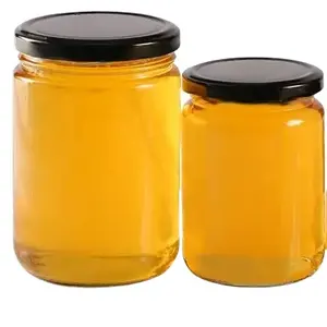 Amostra o mel amadurecido natural puro chinês 100% com cor branca da flor alaranjada embalada na garrafa ou no alimento saudável do cilindro
