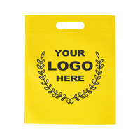 Bolsas de tela no tejida amarillas al por mayor con asa troquelada e impresión de logotipo para compras minoristas y empaque de regalos