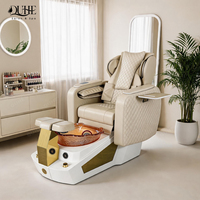 Fauteuil de pédicure électrique de luxe moderne pour salon, avec massage et drainage automatique, idéal pour manucure et soins des pieds.