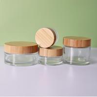 Botol Kosmetik Kaca Silinder Transparan 20ml Custom dengan Tutup Kayu Bambu dan Segel Tarik, Sablon untuk Krim Mata dan Wajah