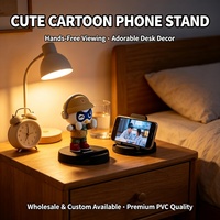Support de téléphone mignon en forme de dessin animé, support de téléphone en caoutchouc souple PVC personnalisé pour bureau, vente en gros OEM/ODM, support de téléphone 3D de personnage de dessin animé de qualité supérieure