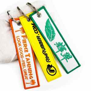 Wholesale 2025 Popular Customized <b>Key</b> Flight Label <b>Custom</b> Jet Tag Fabric Woven Brand Embroidery Keychain Promotional Gifts - Product Image 1