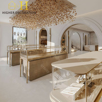 Moderne Juwelier-Ladentheke Marmor Goldrahmen Glas-Wandvitrine Schmuck-Ausstellungsschrank für Luxus-Juweliergeschäft