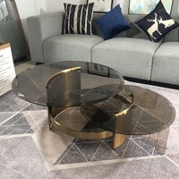 Ensemble de table basse de luxe moderne avec cadre doré en acier inoxydable personnalisé avec plateau en verre rond