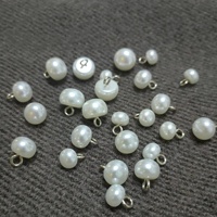 Botones de resina con forma de bollo vaporizado, cosidos a mano, con vástago de cobre y perla, de caña alta, de fábrica de suministro directo, China