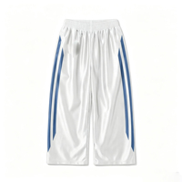 Pantalon de survêtement streetwear épais blanc et bleu avec bande latérale et logo imprimé, taille élastique, coupe large et décontractée, pour le sport