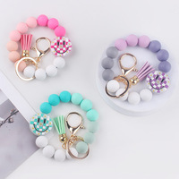 Nouveau design Bracelet porte-clés en silicone coloré avec visage souriant imprimé UV, bracelet de poignet avec pompon, cadeau pour enfants, femmes, couples