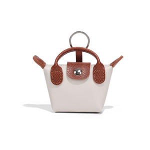 Nouveau <span class=keywords><strong>porte</strong></span>-<span class=keywords><strong>monnaie</strong></span> en forme <span class=keywords><strong>de</strong></span> boulette avec lanières <span class=keywords><strong>de</strong></span> bracelet pochette <span class=keywords><strong>porte</strong></span>-<span class=keywords><strong>monnaie</strong></span> en cuir PU avec <span class=keywords><strong>porte</strong></span>-clés Offre Spéciale pendentif MIniBag - Product Image 5