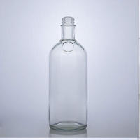 Bottiglia di Vetro Trasparente Rotonda per Liquori da 700ml 750ml con Chiusura a Vite, Personalizzabile all'Ingrosso