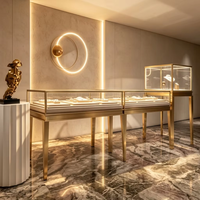 Comptoir de présentation de bijoux en acier inoxydable de luxe, vitrine en verre sur pieds hauts pour boutique de bijoux haut de gamme, vitrine vintage à LED