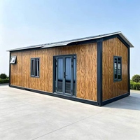Maison préfabriquée en conteneur, résistante aux intempéries, avec aspect bois, portes et fenêtres en verre, pour habitation, bureau ou résidence temporaire