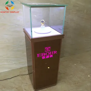 Torre de exhibición de reloj de marca famosa, comercial, escaparate de vidrio, muebles, tienda, diseño Interior con rotación eléctrica