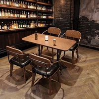 Ensemble table et chaises de bar en bois massif, style minimaliste moderne, avec structure métallique, pour restaurants et cafés commerciaux