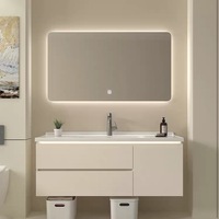 Meuble de salle de bain minimaliste style crème avec vasque en céramique intégrée, ensemble vasque et meuble sous-vasque