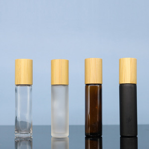 Envases LK al por mayor: Botellas cilíndricas de vidrio de 10 ml, color ámbar esmerilado, transparentes o negras, con estampado en caliente, para perfume y aceites esenciales, con rodillo y tapa de madera. - Product Image 6