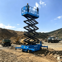 Plateforme élévatrice à ciseaux mobile de 18 m pour travaux en extérieur sur terrain accidenté