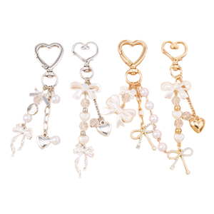 Porte-clés tendance 2026 avec pendentif nœud, strass scintillants, cœur en perle, alliage de zinc, mousqueton étanche, breloque pour sac de téléphone portable - Product Image 1