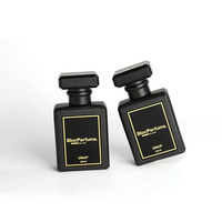 Boîtes de parfum d'emballage de luxe en papier cosmétique de bouteille magnétique noire de 30ml 50ml 100ml avec logo personnalisé