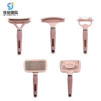 Série d'outils de toilettage pour animaux de compagnie en acier inoxydable rose mignon, fabriqués en usine OEM, peigne démêlant et brosse autonettoyante pour chats et chiens