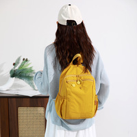 Sac à dos décontracté élégant avec tissu résistant et poche avant zippée, idéal pour les escapades de week-end, le travail ou l'exploration urbaine