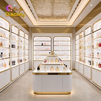 Vitrine murale moderne de luxe en acier inoxydable doré, écologique, de haute qualité, pour présentation de parfums, avec rétroéclairage LED et finition laquée blanche