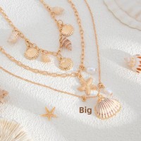 Collier pour femme en or 14 carats, style bohème, multi-couches, avec pendentifs étoile de mer, coquillage, conque et perles d'imitation, chaîne de clavicule haut de gamme