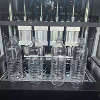 Machine de soufflage semi-automatique à 4 cavités contrôlée par PLC avec alimentateur automatique de préformes pour bouteilles PET d'eau minérale et de boissons 1500