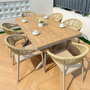 Ensemble de salle à manger de patio Loran moderne et durable pour l'extérieur, plateau de table en bois composite, cadre en aluminium, chaises en rotin, coussins en tissu, 6 pièces - Product Image 1