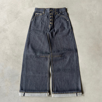 Jeans en denim brut à poche incurvée et boucle arrière, braguette boutonnée, jambe large, denim selvedge, double poche arrière, boucles croisées, jeans baggy