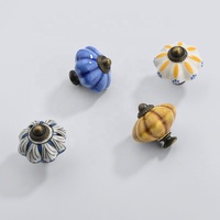Boutons de meuble classiques élégants et traditionnels en céramique et alliage de zinc de type rond pour tiroirs de commode de chambre d'hôtel