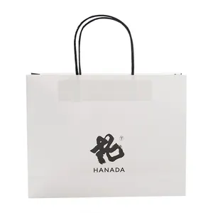 Venta al por mayor de ropa de lujo con logotipo de marca personalizado impreso, promoción de diseño, regalo al por menor, compras, joyería, bolsa de papel con asa