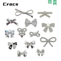 Accessoires de chaussures en plastique argenté détachables avec nœud papillon - Breloques DIY pour sabots, tendance Xiaohongshu, vente en gros