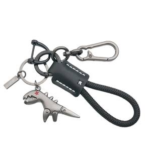 LLavero de aleación de <span class=keywords><strong>dinosaurio</strong></span> pequeño de dibujos animados transfronterizo chica coche cuero cosido a mano cuerda trenzada mochila colgante regalo - Product Image 5