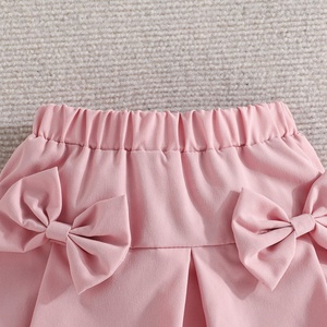 Ensemble Deux Pièces T-shirt à Manches Bulles et Jupe Courte à Nœud Couleur Unie pour Filles – Vente en Gros - Product Image 6