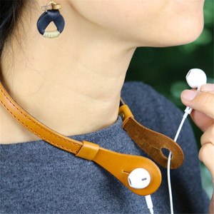 Correa elegante de cuero para auriculares, correa deportiva antipérdida y anticaída para auriculares con cable, logotipo personalizado del fabricante. - Product Image 1