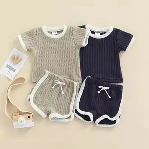 Set baju + celana bayi balita lelaki, setelan baju monyet lengan pendek kotak-kotak rajut bergaris anak baru lahir musim panas