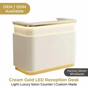 Bureau <span class=keywords><strong>d</strong></span>'<span class=keywords><strong>accueil</strong></span> de luxe avec éclairage LED OEM |   Fabricant en gros de comptoirs de salon personnalisés en or crème brillant - Product Image 1