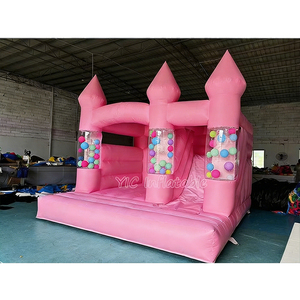 Château gonflable rose pastel avec toboggan, structure gonflable commerciale pour location événementielle, avec piliers transparents pour balles - Product Image 1