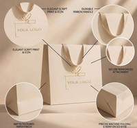 Sac en papier ivoire de luxe personnalisé avec logo doré, élégant sac cadeau avec large poignée en ruban, sac de shopping haut de gamme