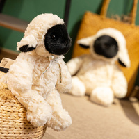 Adorable peluche de mouton noir en trois tailles avec nœud floral, parfaite pour câliner, décorer la maison et offrir des cadeaux mignons pour tous les âges