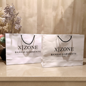 Luxury White Kraft <b>Paper</b> Carry Bags Custom Printed with Durable Rope Handles for Boutique Shopping and Gift Packaging - Product Image 1