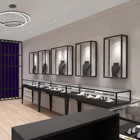 Vitrine à bijoux avec plateau en verre, base en bois foncé, pieds en métal doré, verre trempé, présentoir étagé pour boutique de détail