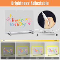 Tableau lumineux de Noël LED 7 couleurs en acrylique avec adaptateur, chaîne de suspension, support, 7 marqueurs, flacon pulvérisateur et bouton de gradation