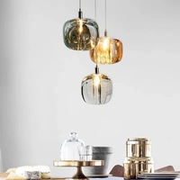 Lustre design créatif de luxe moderne à tête unique ovale et lampes suspendues en verre pour escaliers