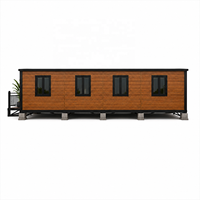 Maison préfabriquée moderne en conteneur avec terrasse, finition bois, maisonnette modulaire pour usage résidentiel, jardin et complexe hôtelier