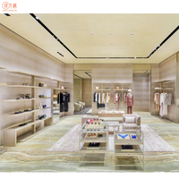Boutique Vitrine de vêtements haut de gamme Personnalisation de vêtements de luxe Affichage en verre Haute Couture